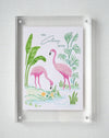 Colony Hotel flamingo painting displayed in a clear acrylic block frame