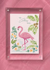 Framed Colony Hotel flamingo painting photographed against a pink background