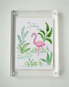 Colony Hotel flamingo and tropical foliage painting in a clear acrylic block frame
